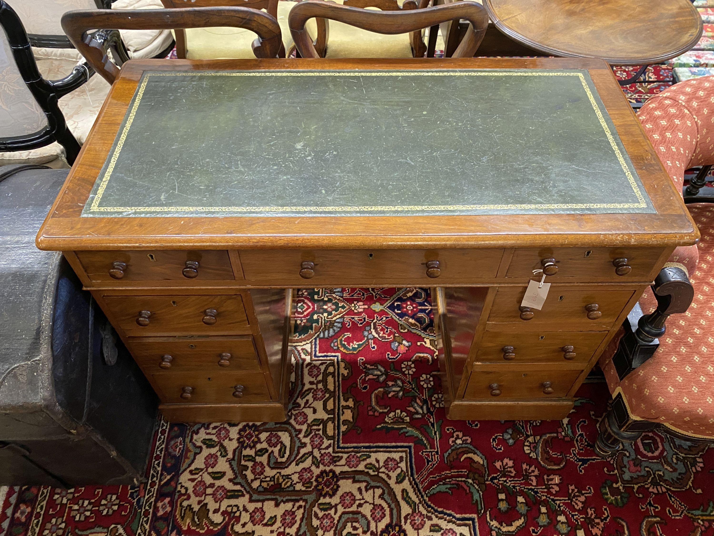 A small Victorian walnut pedestal desk, length 104cm, depth 54cm, height 73cm